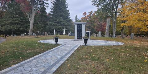 Stone paved walkway to the new columbaria at Elmwood Cemetery during a fall afternoon